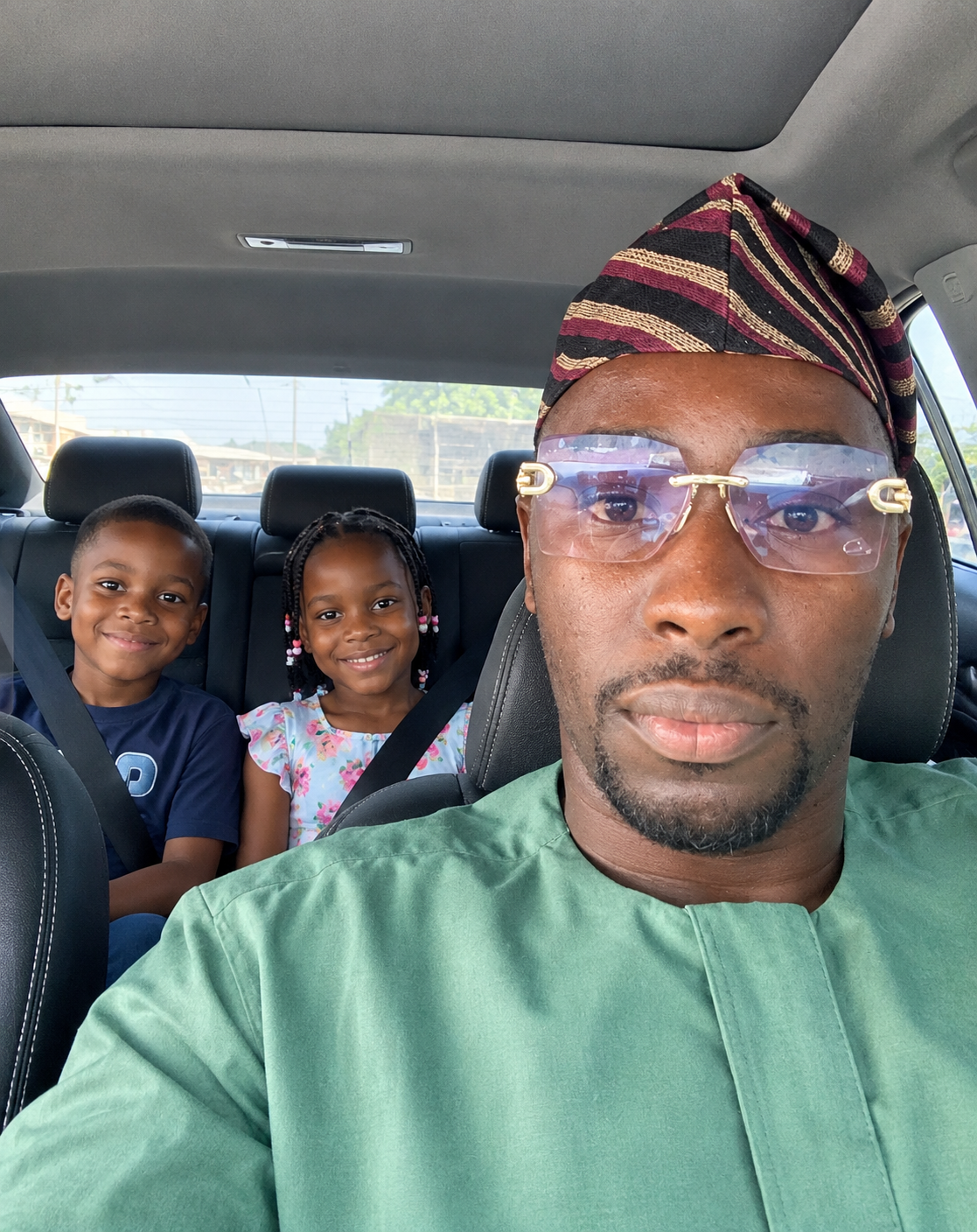 Tunde Bello with his two children